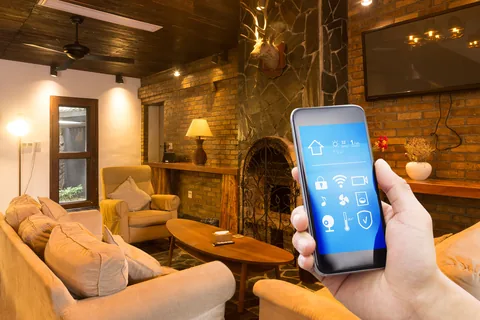smart phone with smart home and modern restaurant in hotel