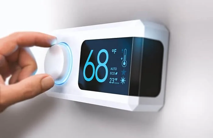 Smart Nest thermostat being set