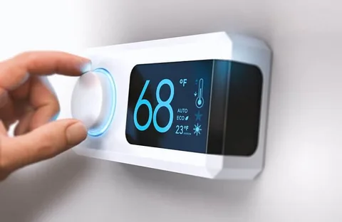 Smart Nest thermostat being set