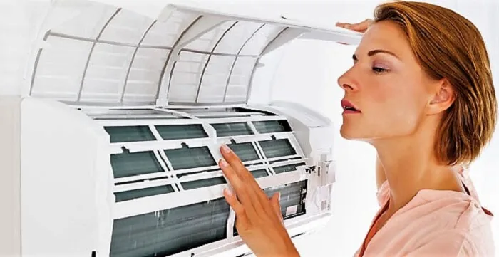 Woman checking the AC